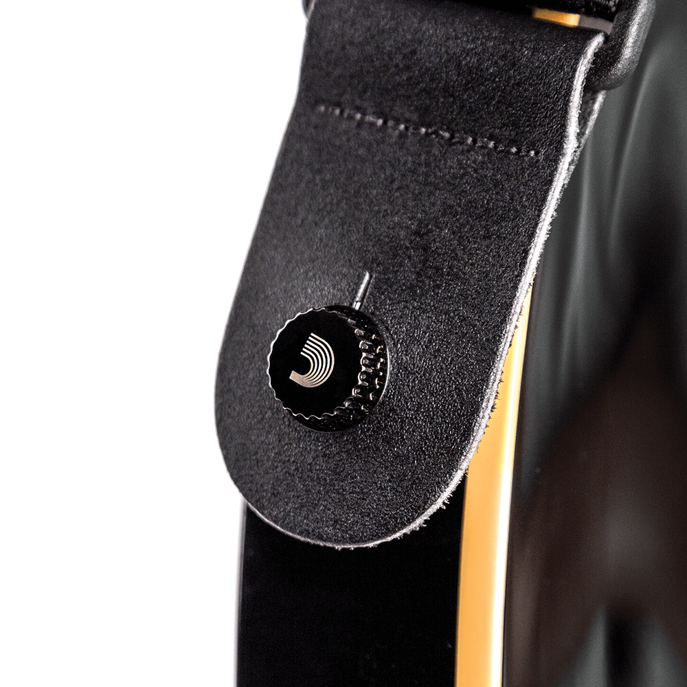 D'Addario Universal Strap Lock System gold, fitted to a strap